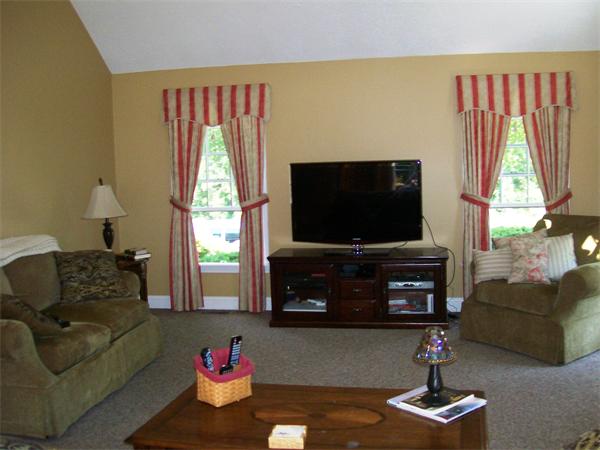 2 Forge Lane Sutton, MA 01590 - Photo 7 of 18 a living room with furniture a flat screen tv and a window