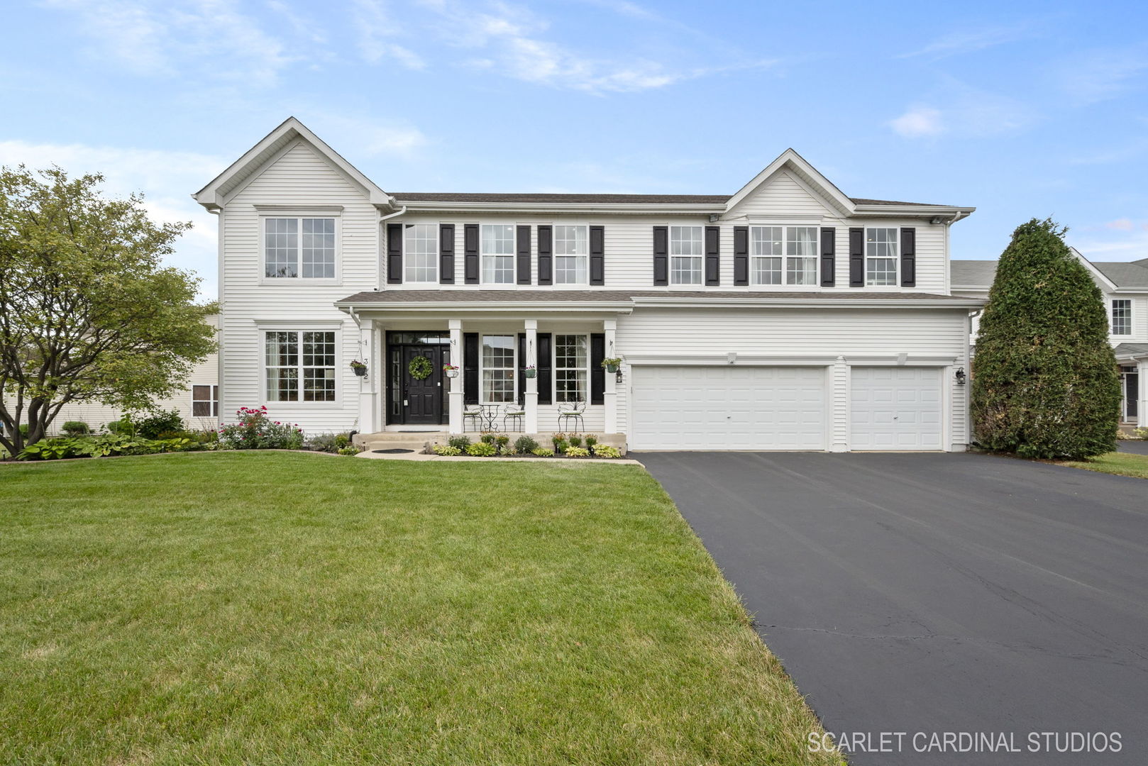 front view of a house with a yard