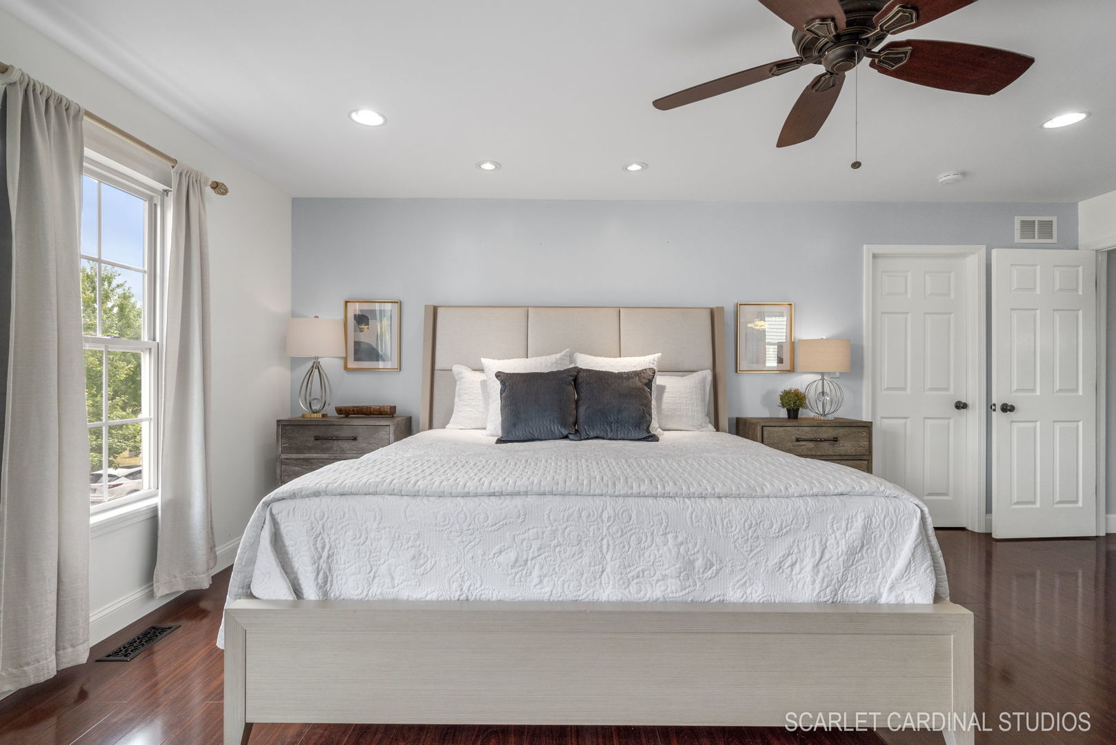 312 Veronica Circle Bartlett, IL 60103 - Photo 18 of 45 a large bed sitting in a spacious bedroom next to a window and a chandelier