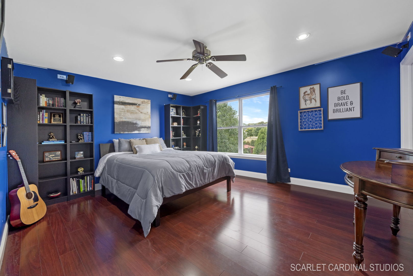 312 Veronica Circle Bartlett, IL 60103 - Photo 25 of 45 a spacious bedroom with a bed and a wooden floor