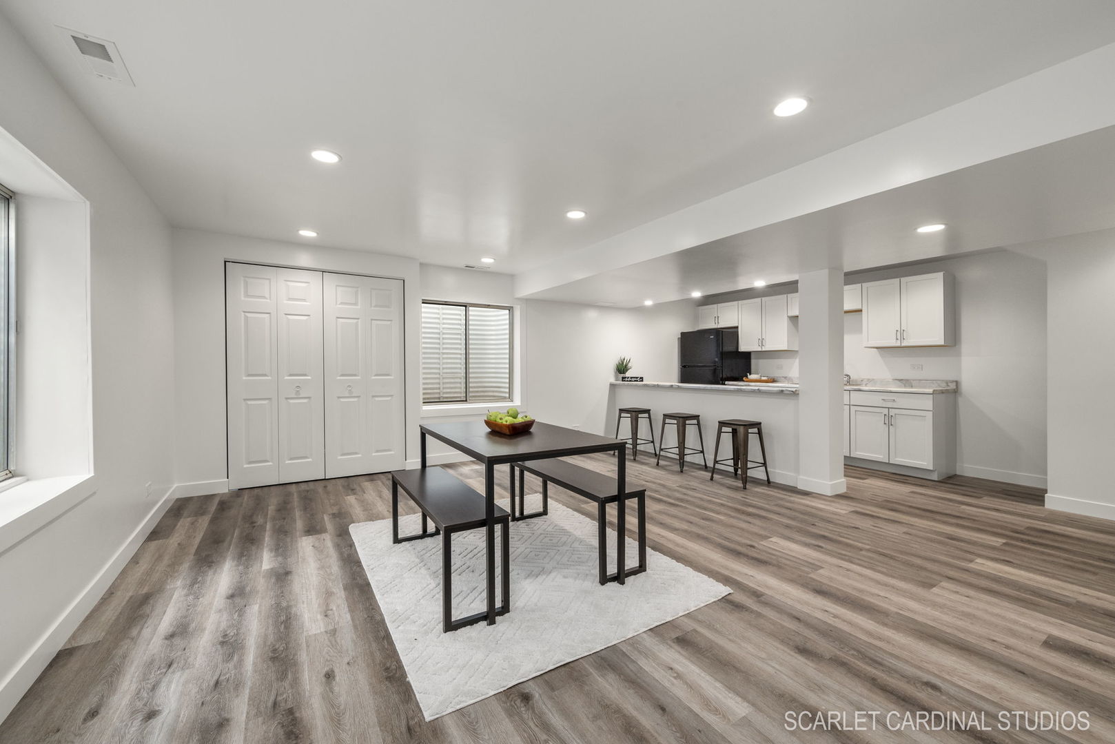 312 Veronica Circle Bartlett, IL 60103 - Photo 27 of 45 a view of a kitchen with kitchen island a sink dishwasher a dining table and chairs with wooden floor