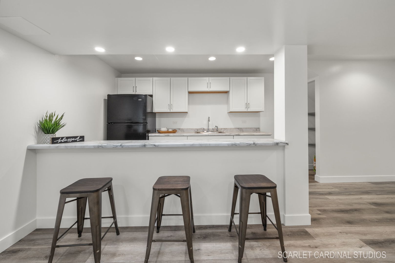 312 Veronica Circle Bartlett, IL 60103 - Photo 28 of 45 a kitchen with stainless steel appliances granite countertop a table chairs refrigerator and microwave