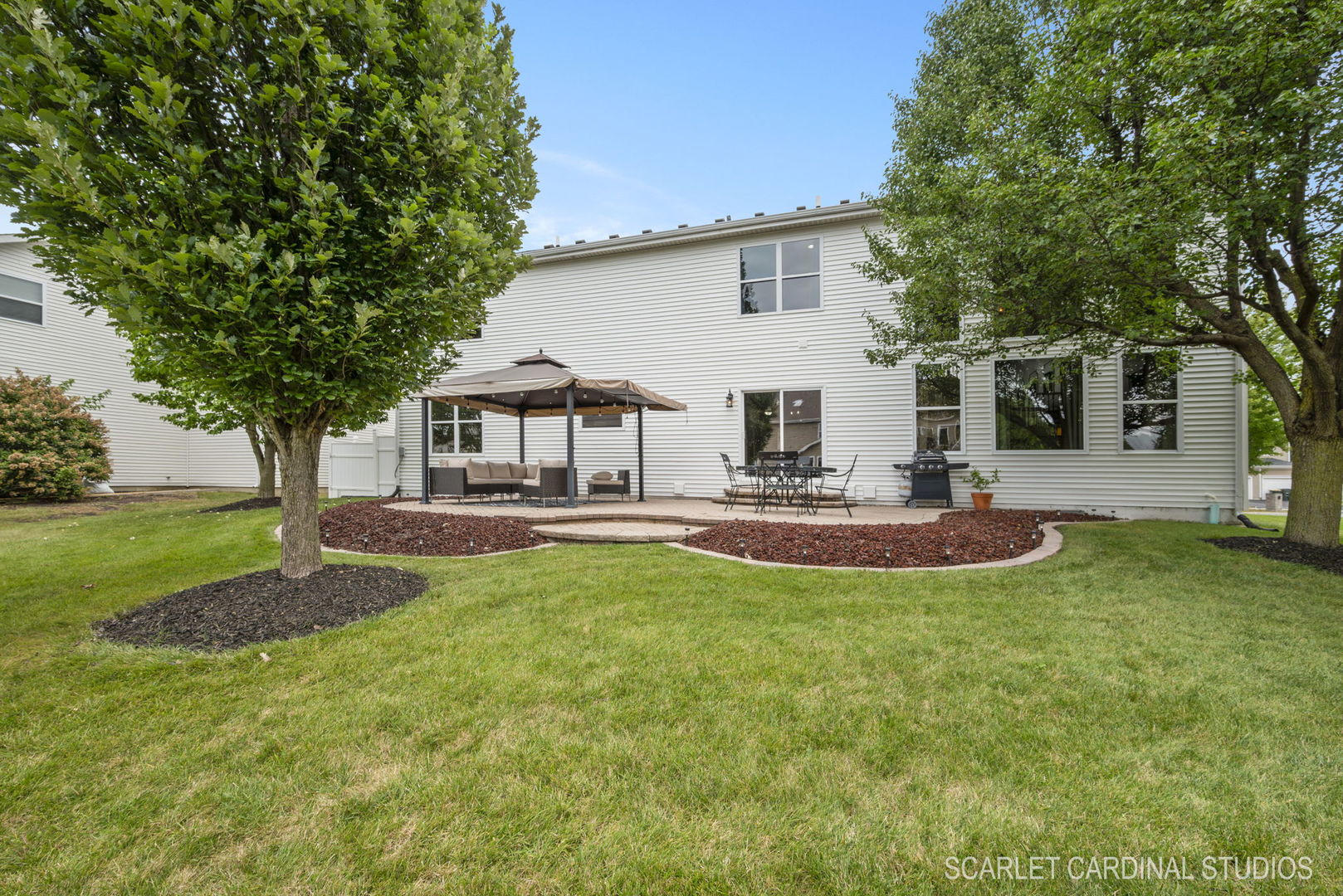 312 Veronica Circle Bartlett, IL 60103 - Photo 36 of 45 a view of a house with a backyard porch and sitting area