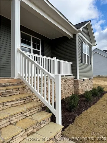 a front view of a house with a porch
