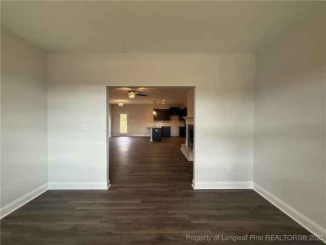 a kitchen with granite countertop stainless steel appliances and wooden cabinets