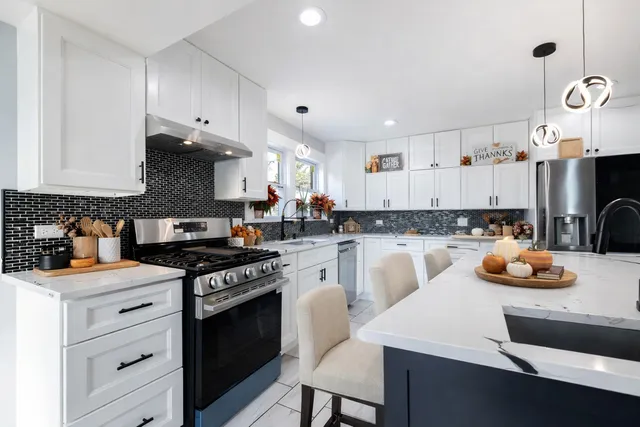 a living room with fireplace and furniture