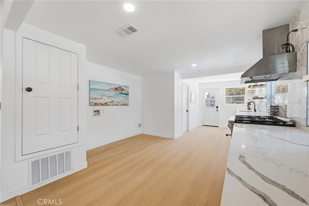 1280 East Woodbury Road Pasadena, CA 91104 - Photo 16 of 40 a view of a kitchen with wooden floor