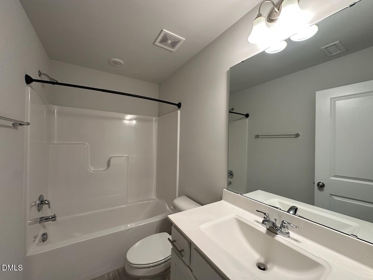 2521 Laurel Valley Way Raleigh, NC 27604 - Photo 6 of 25 a bathroom with a sink toilet and shower