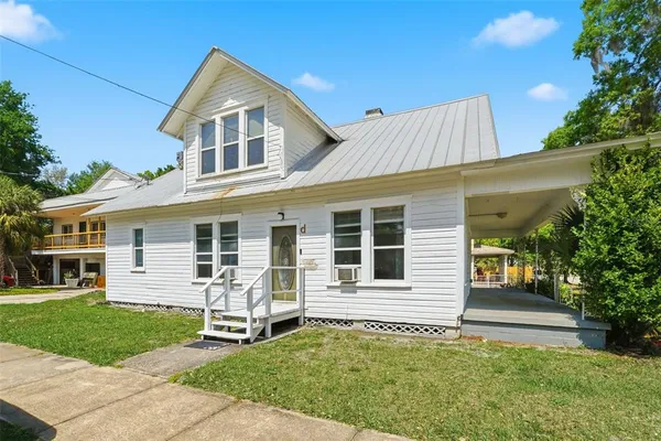 front view of a house with a yard