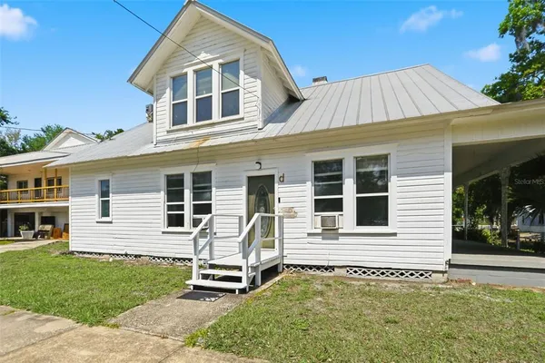 front view of a house with a yard