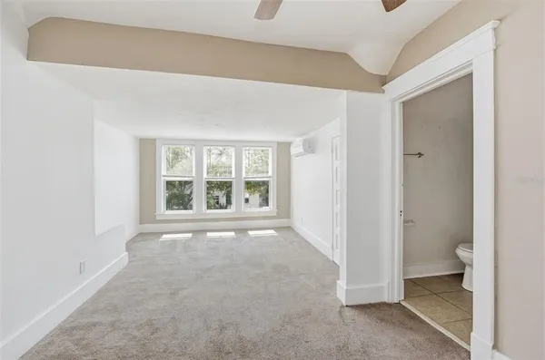 a view of an empty room with a window