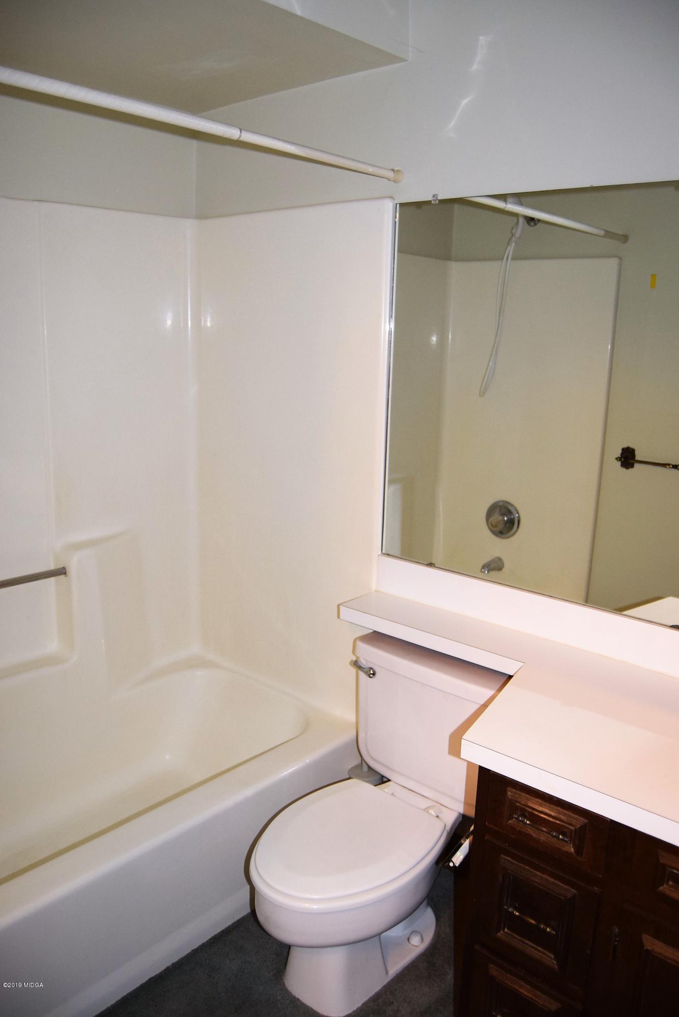 6350 Thomaston Road Macon, GA 31220 - Photo 22 of 38 a bathroom with a sink a toilet and shower