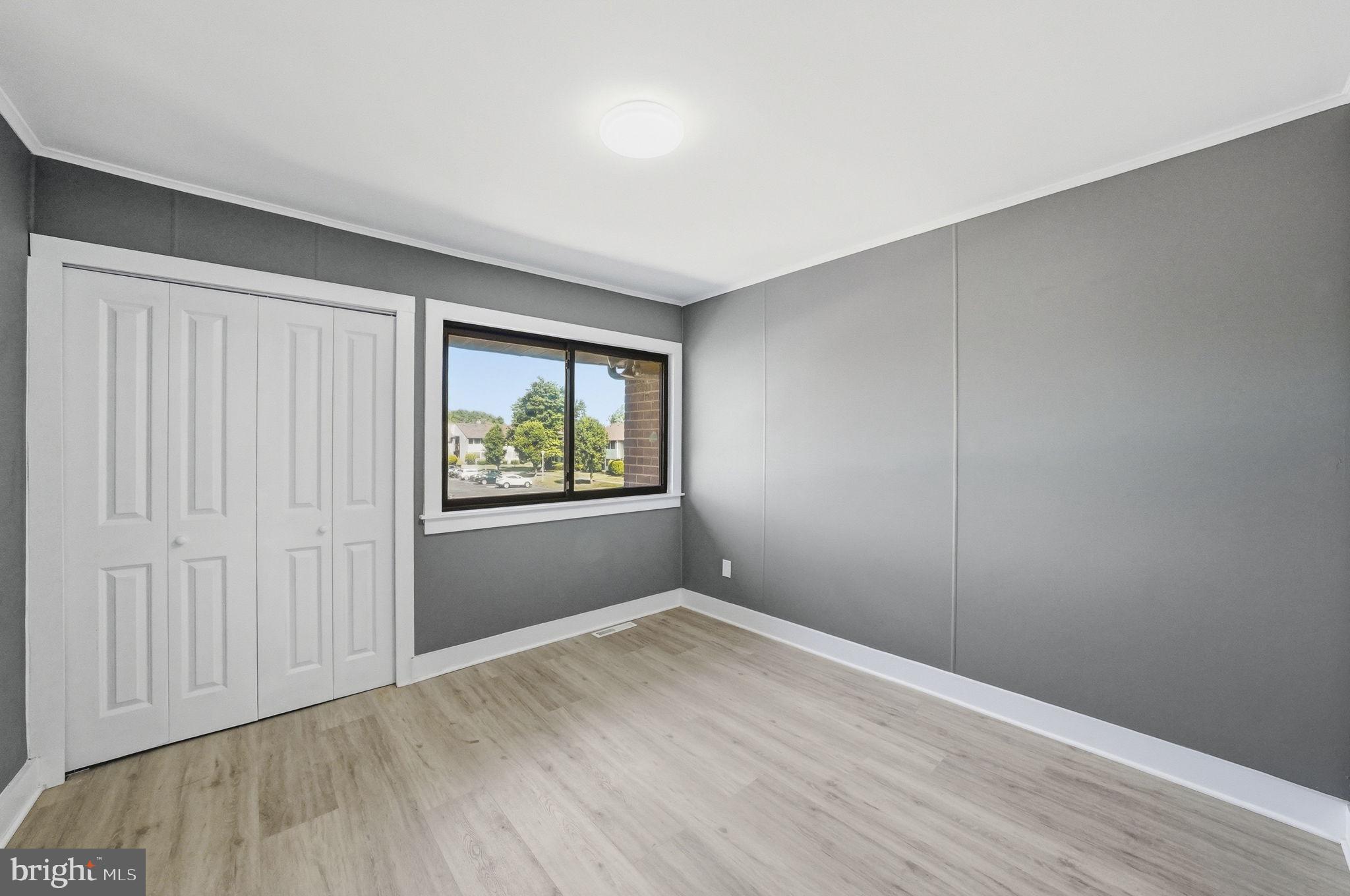 371 Bolton Road East Windsor, NJ 08520 - Photo 14 of 20 an empty room with wooden floor and windows