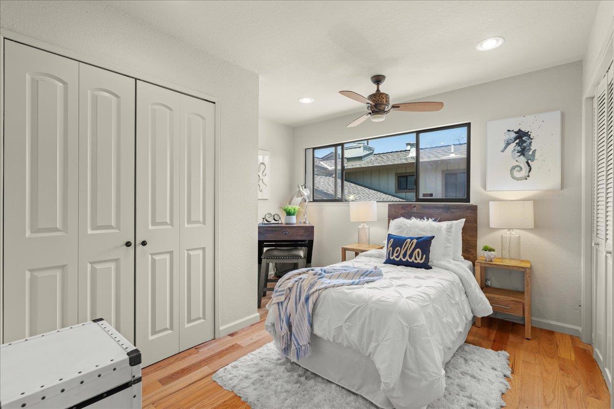 6109 Sheraton Place Aptos, CA 95003 - Photo 18 of 31 a bed room with a bed and a chandelier