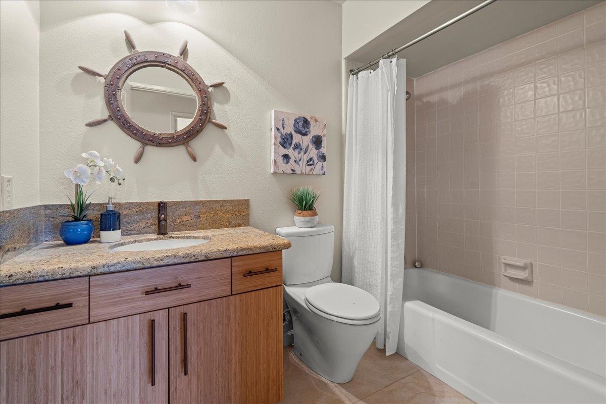 6109 Sheraton Place Aptos, CA 95003 - Photo 19 of 31 a bathroom with a granite countertop sink a toilet and a bathtub