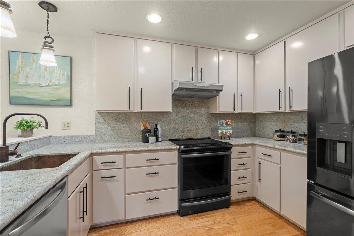 6109 Sheraton Place Aptos, CA 95003 - Photo 5 of 31 a kitchen with stainless steel appliances granite countertop a sink stove and refrigerator