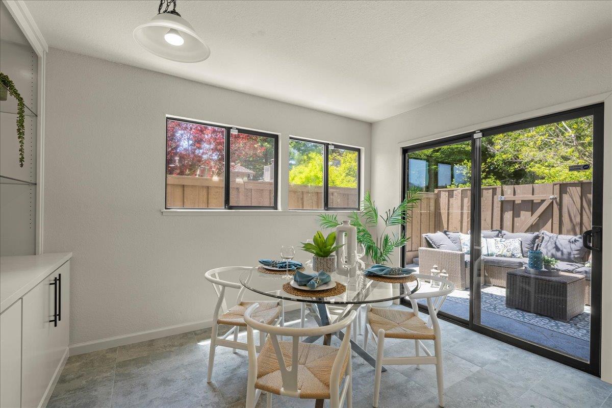 6109 Sheraton Place Aptos, CA 95003 - Photo 8 of 31 a dining room with furniture and a floor to ceiling window