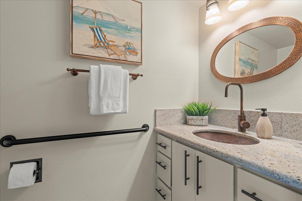 6109 Sheraton Place Aptos, CA 95003 - Photo 10 of 31 a bathroom with a granite countertop sink a mirror and vanity