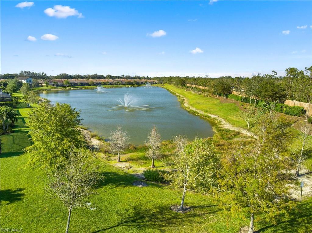 10256 Coconut Road Estero, FL 34135 - Photo 44 of 45 a view of a lake with a city