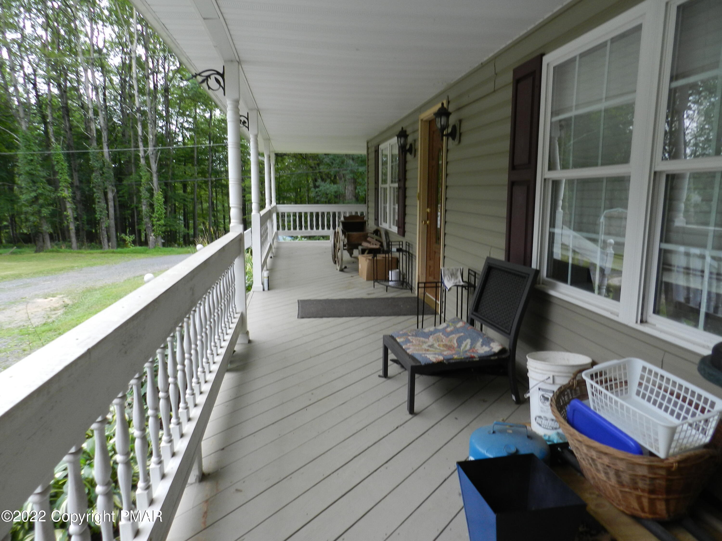 1269 Burger Hollow Road Effort, PA 18330 - Photo 13 of 49 a sitting area with furniture and wooden deck