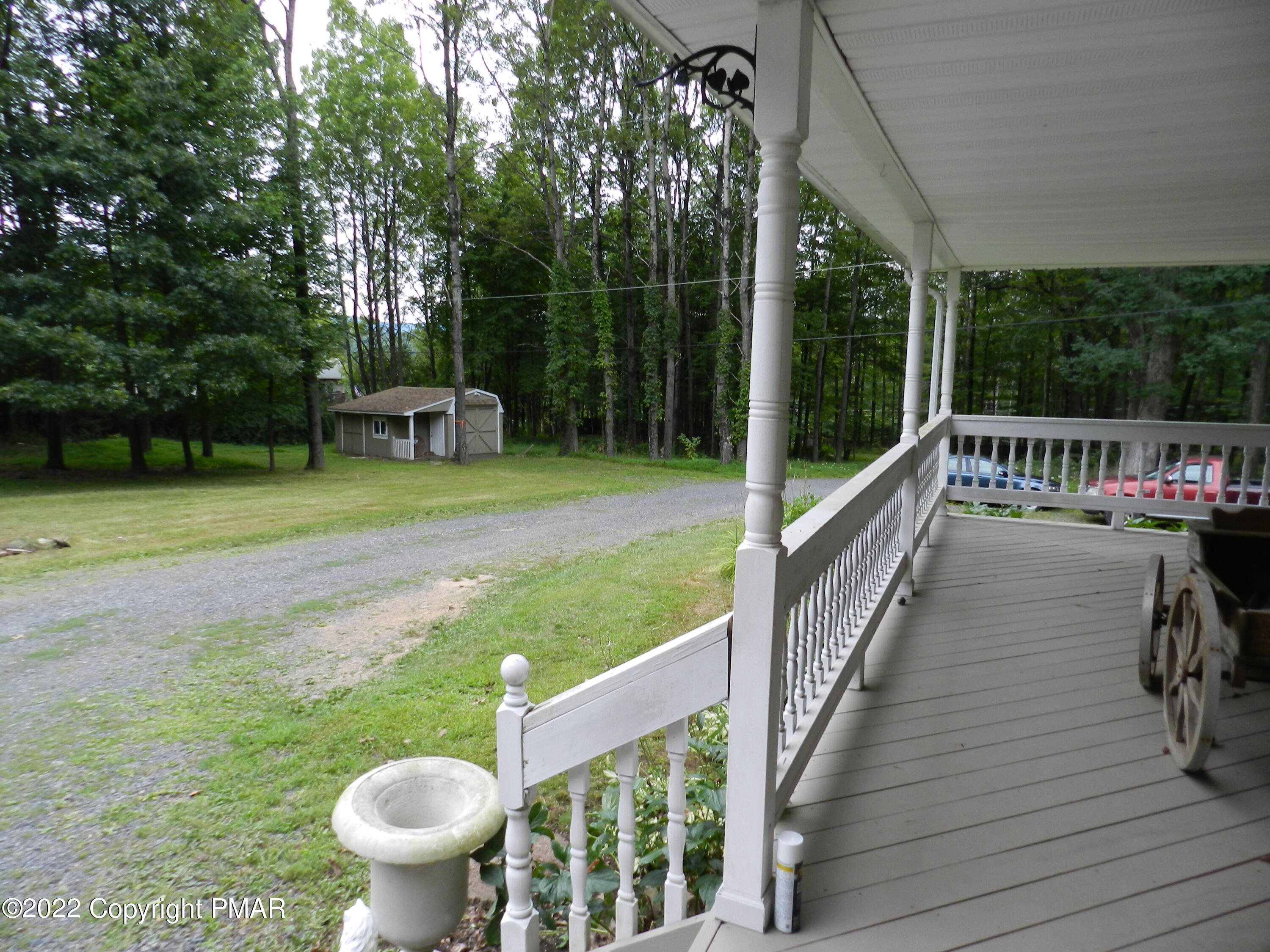 1269 Burger Hollow Road Effort, PA 18330 - Photo 16 of 49 a view of a patio with chairs and a yard