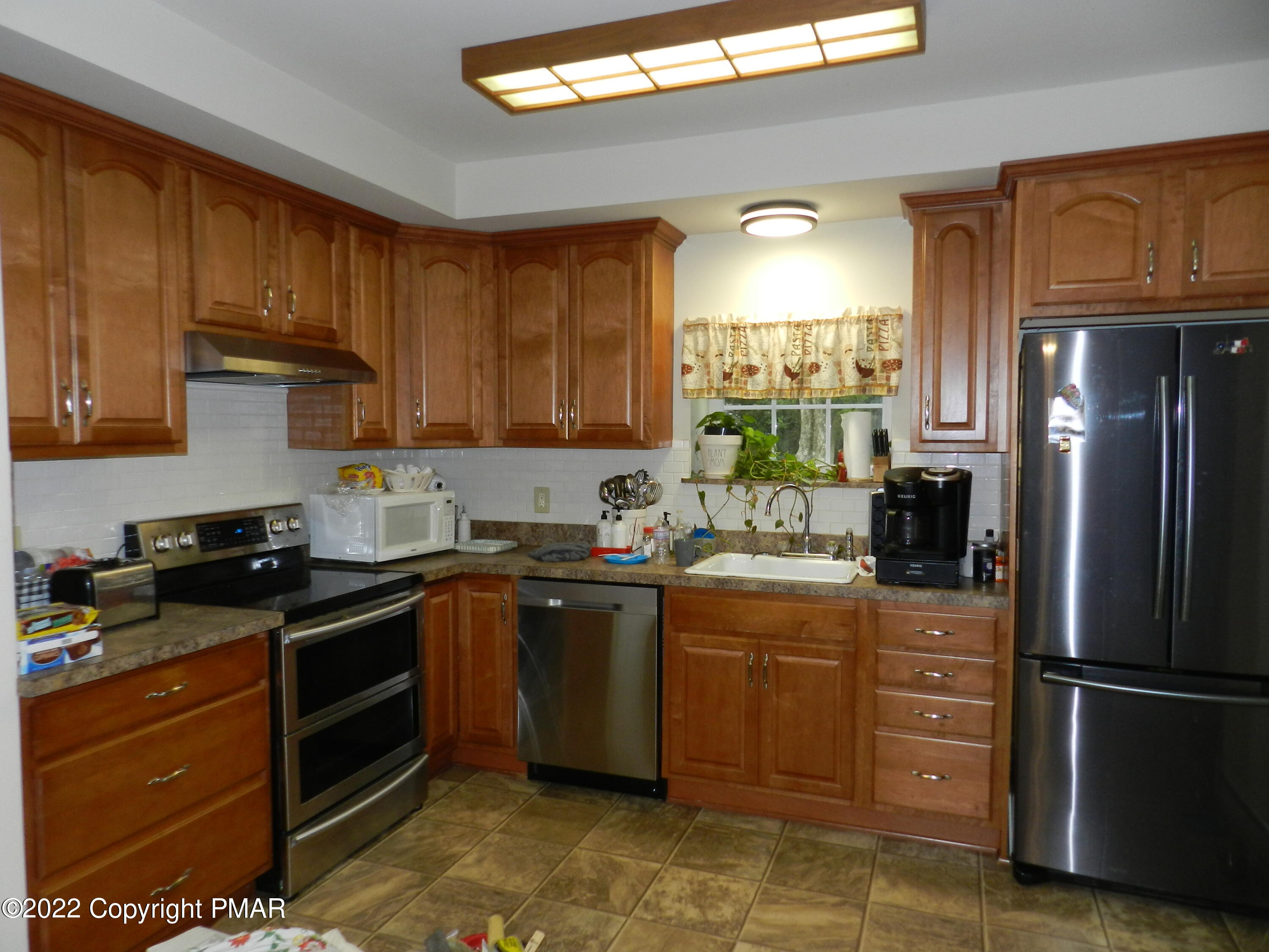 1269 Burger Hollow Road Effort, PA 18330 - Photo 22 of 49 a kitchen with a refrigerator stove and sink