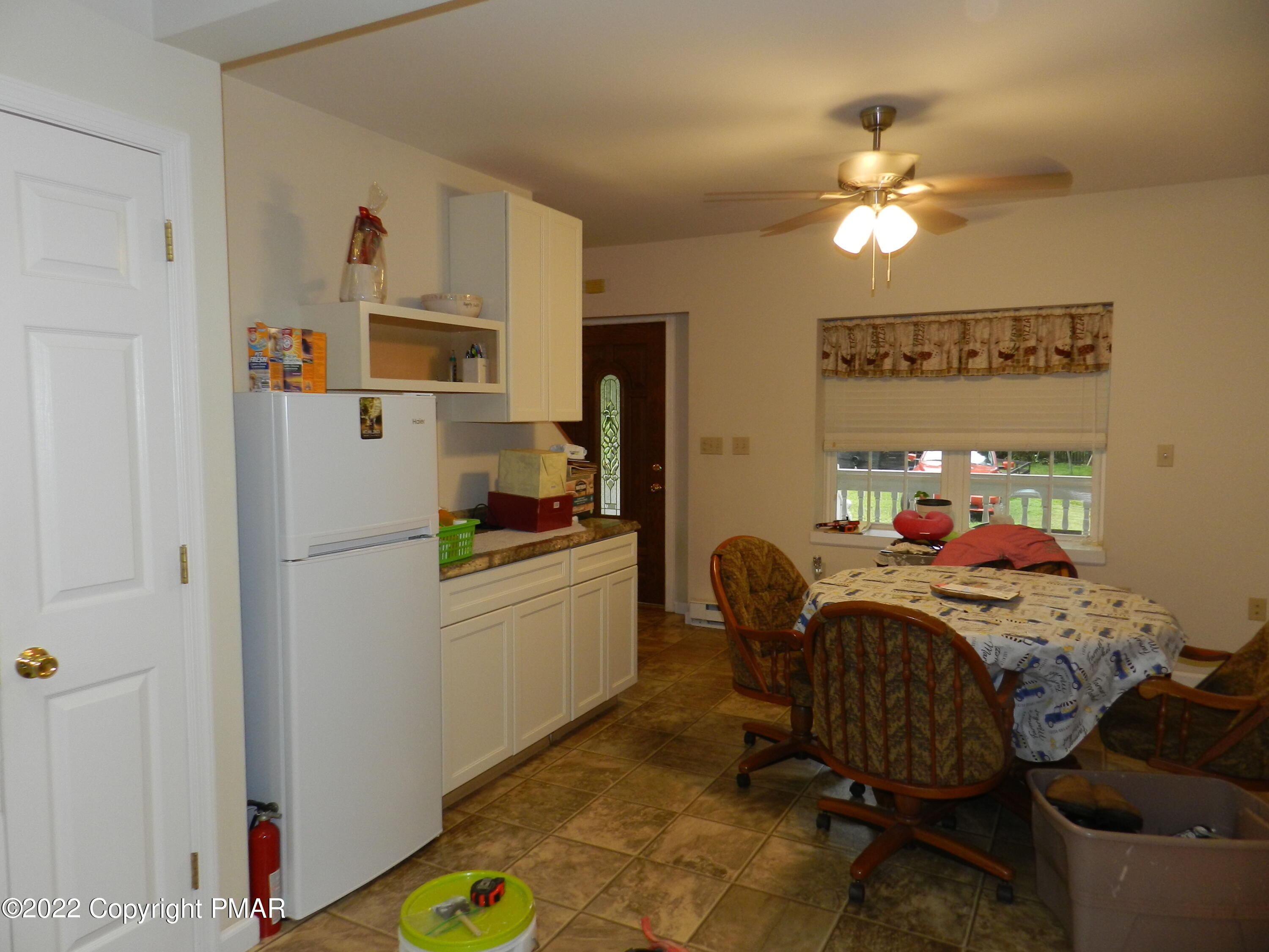 1269 Burger Hollow Road Effort, PA 18330 - Photo 23 of 49 a bedroom with a bed and a chandelier