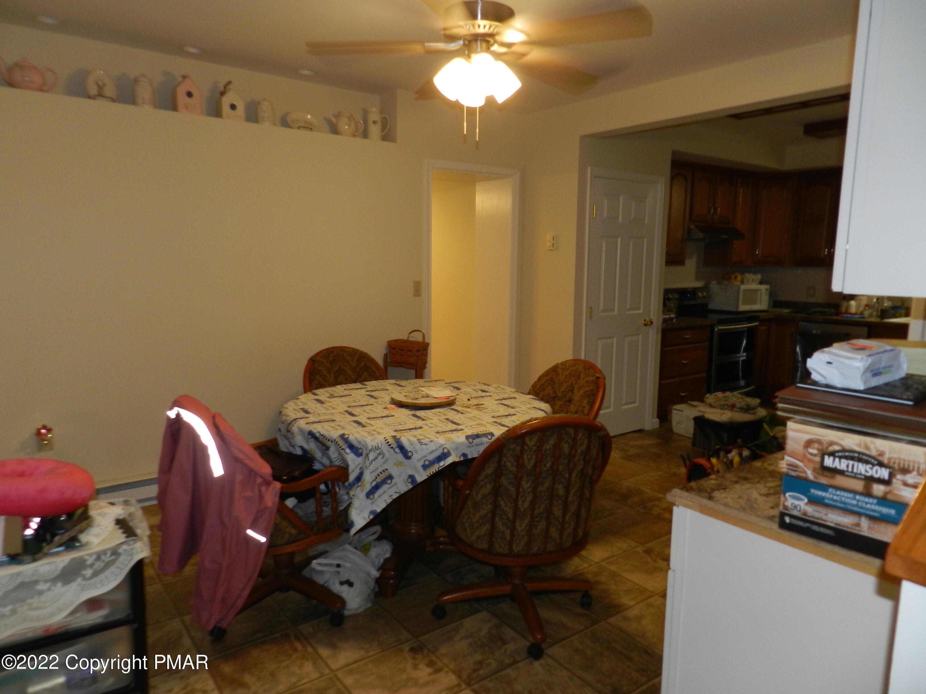 1269 Burger Hollow Road Effort, PA 18330 - Photo 24 of 49 a bedroom with a bed and a chandelier