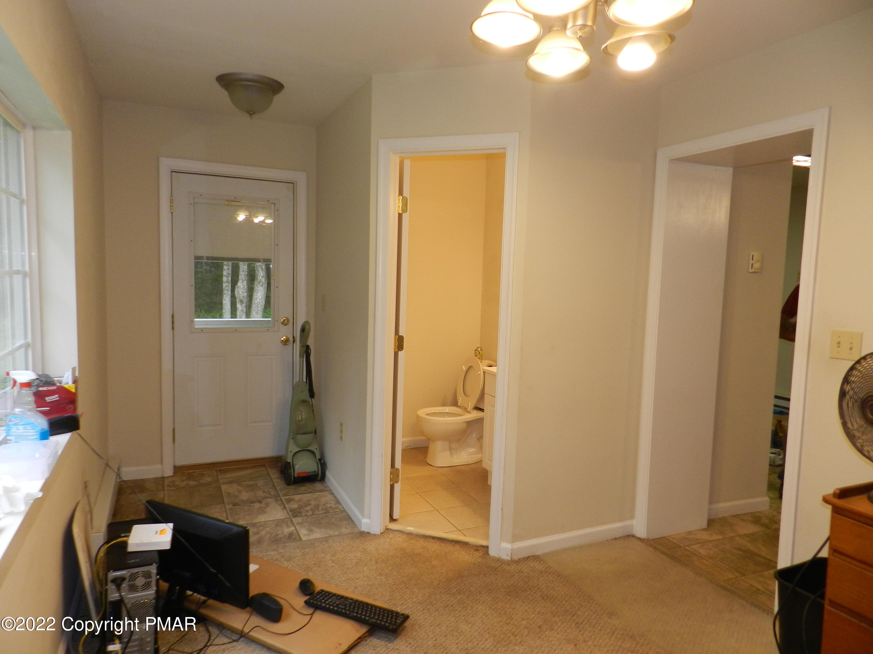 1269 Burger Hollow Road Effort, PA 18330 - Photo 27 of 49 a view of a livingroom with bathroom and front door