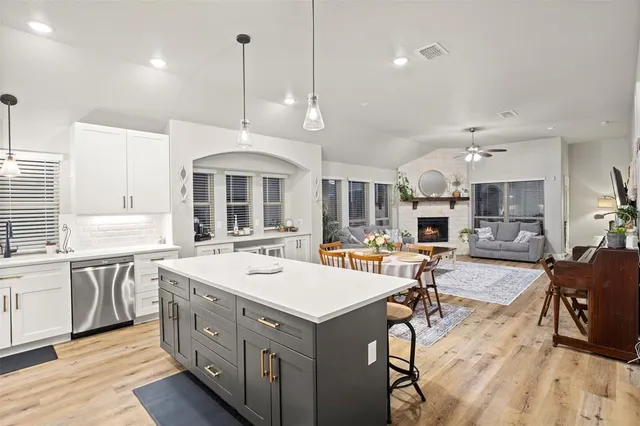 a view of a center island kitchen island furniture and living room