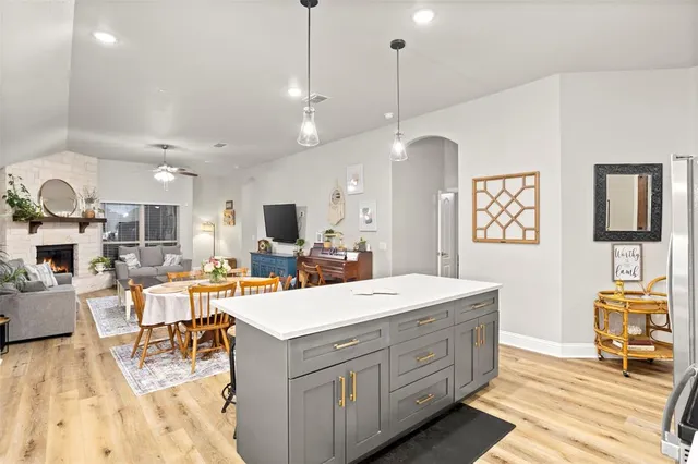 a kitchen with a stove and a microwave