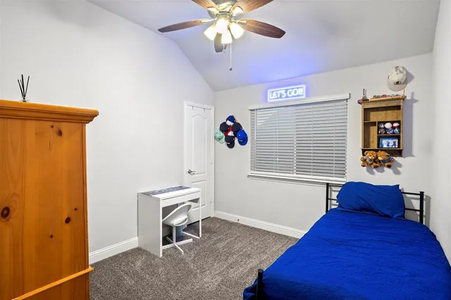 a bed room with a bed and a chandelier