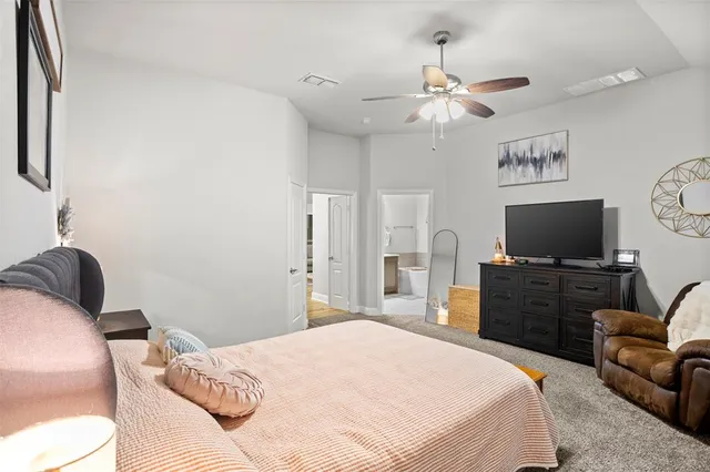 a bathroom with a double vanity sink mirror and bathtub