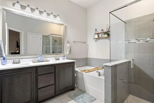 a bathroom with a bathtub and shower