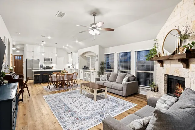 a view of a livingroom with furniture and a fireplace