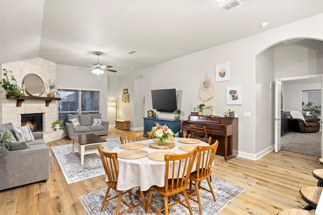 a dining room with furniture and wooden floor