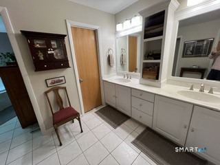 72 Pinnacle Road Ellington, CT 06029 - Photo 27 of 38 a bathroom with a sink a mirror and a toilet