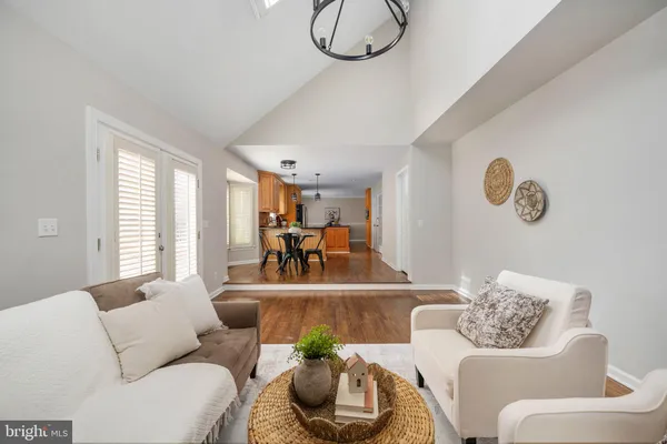 a kitchen with stainless steel appliances granite countertop a stove refrigerator and a sink
