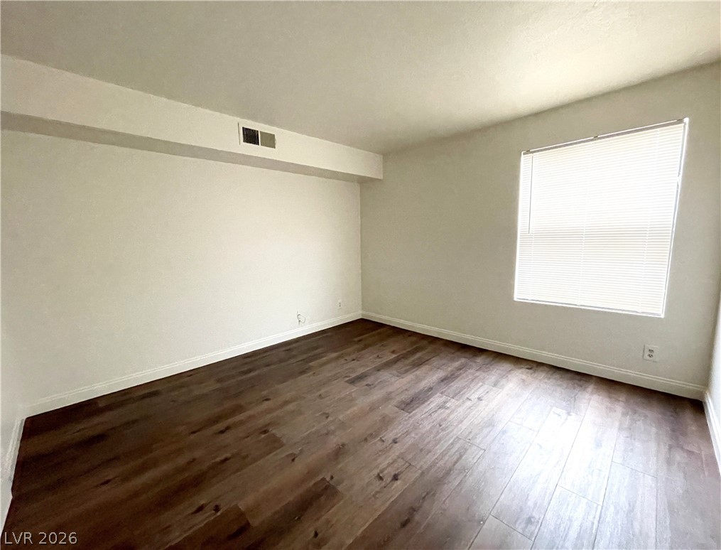 3135 South Mojave Road, Unit 221 Las Vegas, NV 89121 - Photo 13 of 19 Rich hardwood-style flooring extends across this spacious, naturally illuminated room.