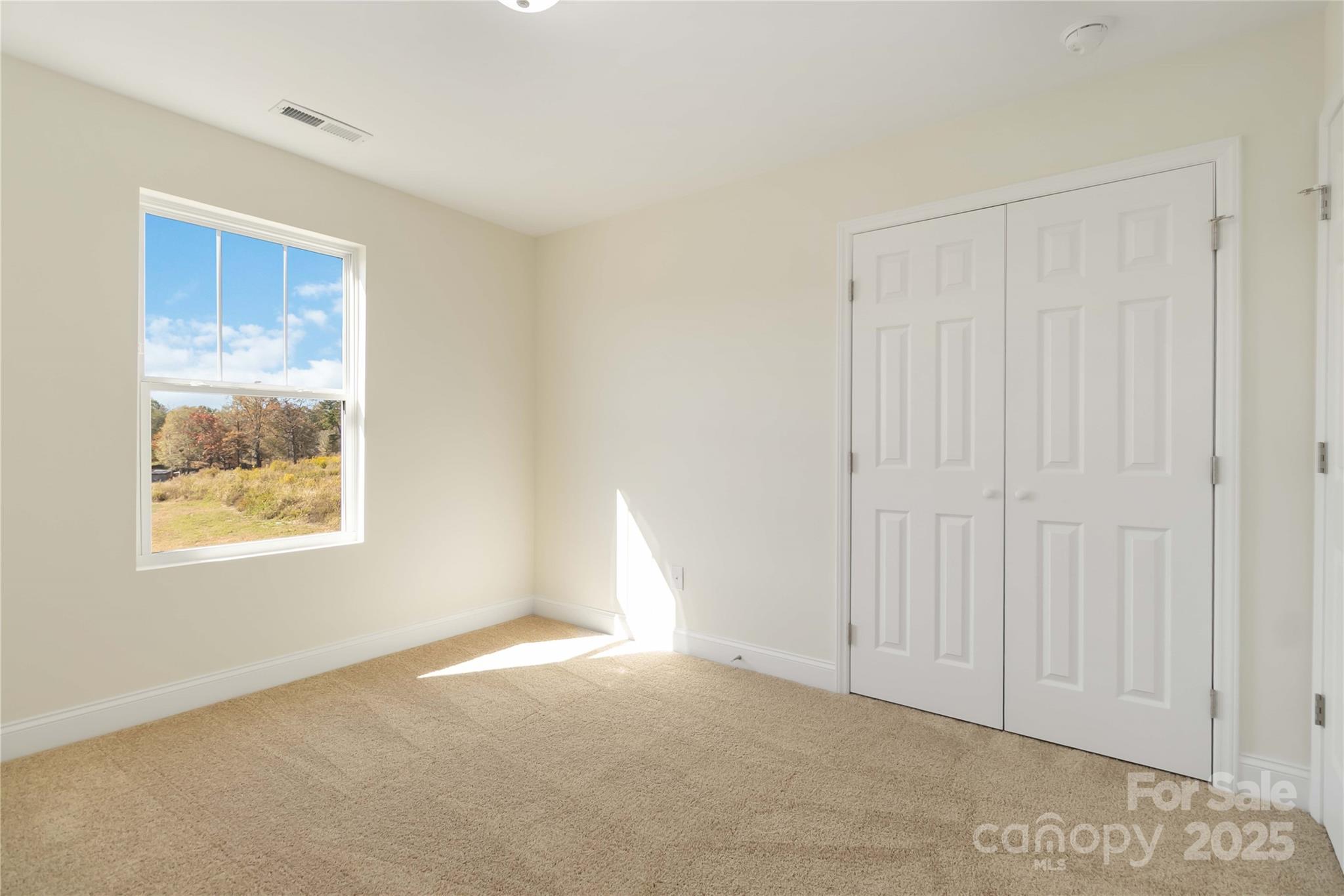 1018 Heath Helms Road Monroe, NC 28110 - Photo 17 of 38 an empty room with windows