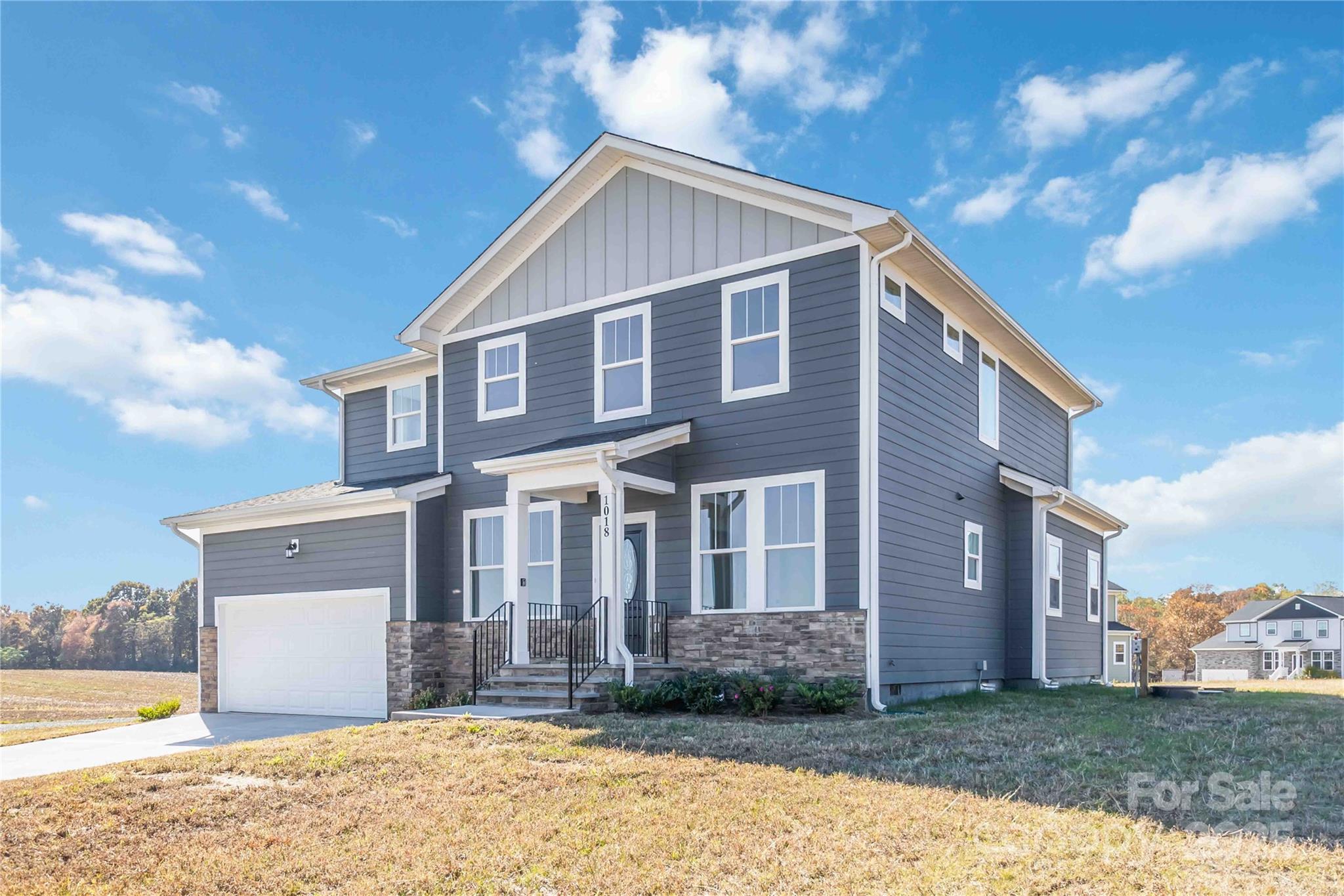 1018 Heath Helms Road Monroe, NC 28110 - Photo 2 of 38 a view of a house with a yard