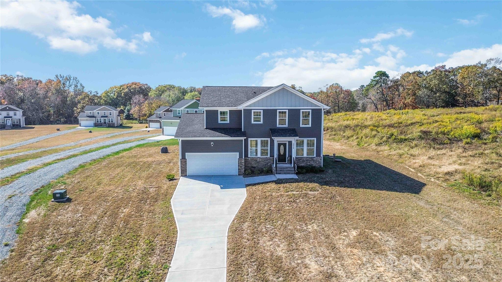 1018 Heath Helms Road Monroe, NC 28110 - Photo 32 of 38 a view of a house with a yard