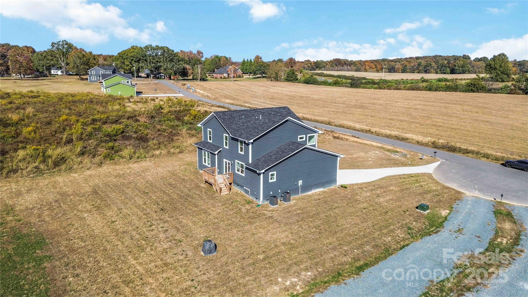 1018 Heath Helms Road Monroe, NC 28110 - Photo 35 of 38 a view of a lake with a yard