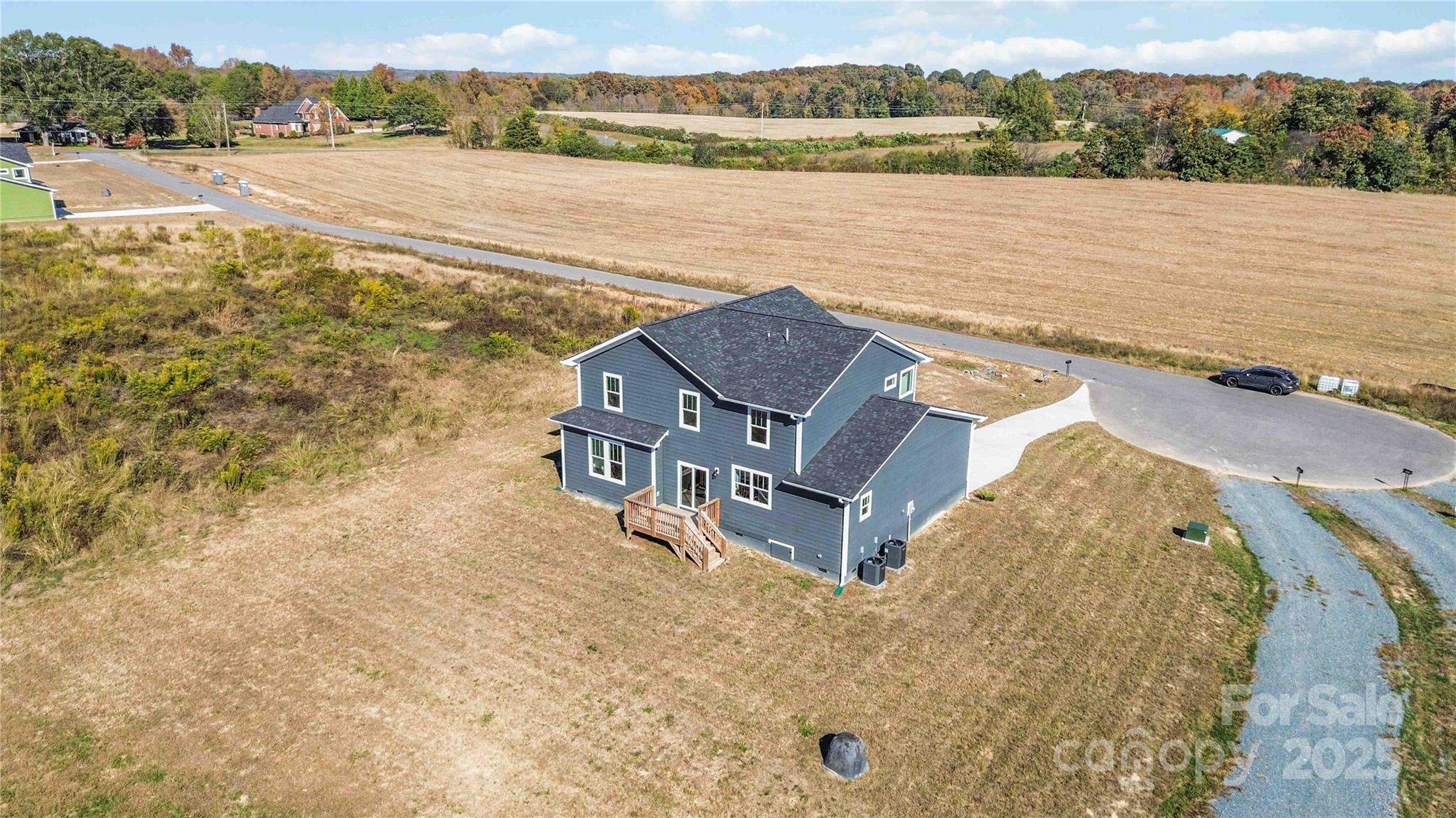 1018 Heath Helms Road Monroe, NC 28110 - Photo 36 of 38 an aerial view of a house with a lake view
