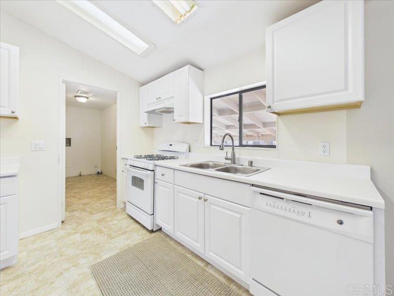 37589 Montezuma Valley Road Ranchita, CA 92066 - Photo 22 of 43 a kitchen with granite countertop white cabinets and white appliances