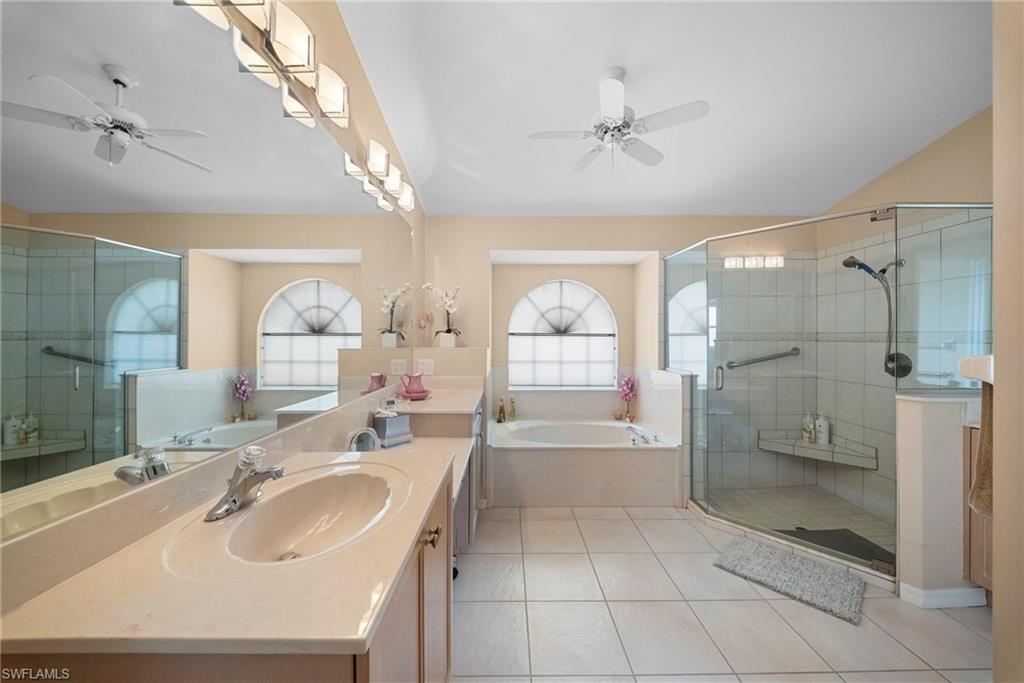 3971 Spring Garden Lane Estero, FL 33928 - Photo 29 of 31 a bathroom with a sink a toilet and shower