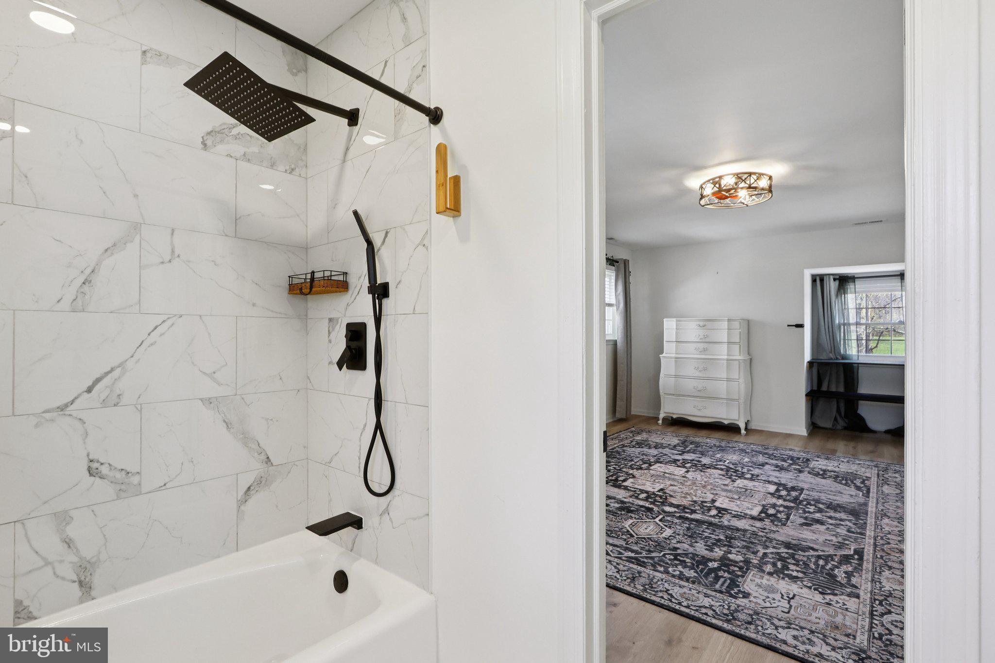 351 Merrick Road Robbinsville, NJ 08691 - Photo 38 of 69 a bathroom with a bathtub and a shower