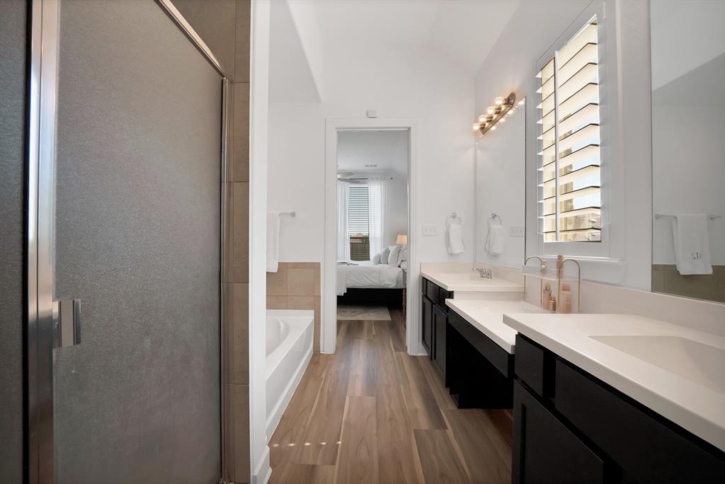 1709 Shetland Road Aubrey, TX 76227 - Photo 21 of 35 a en suite bathroom with a double vanity sink and a mirror
