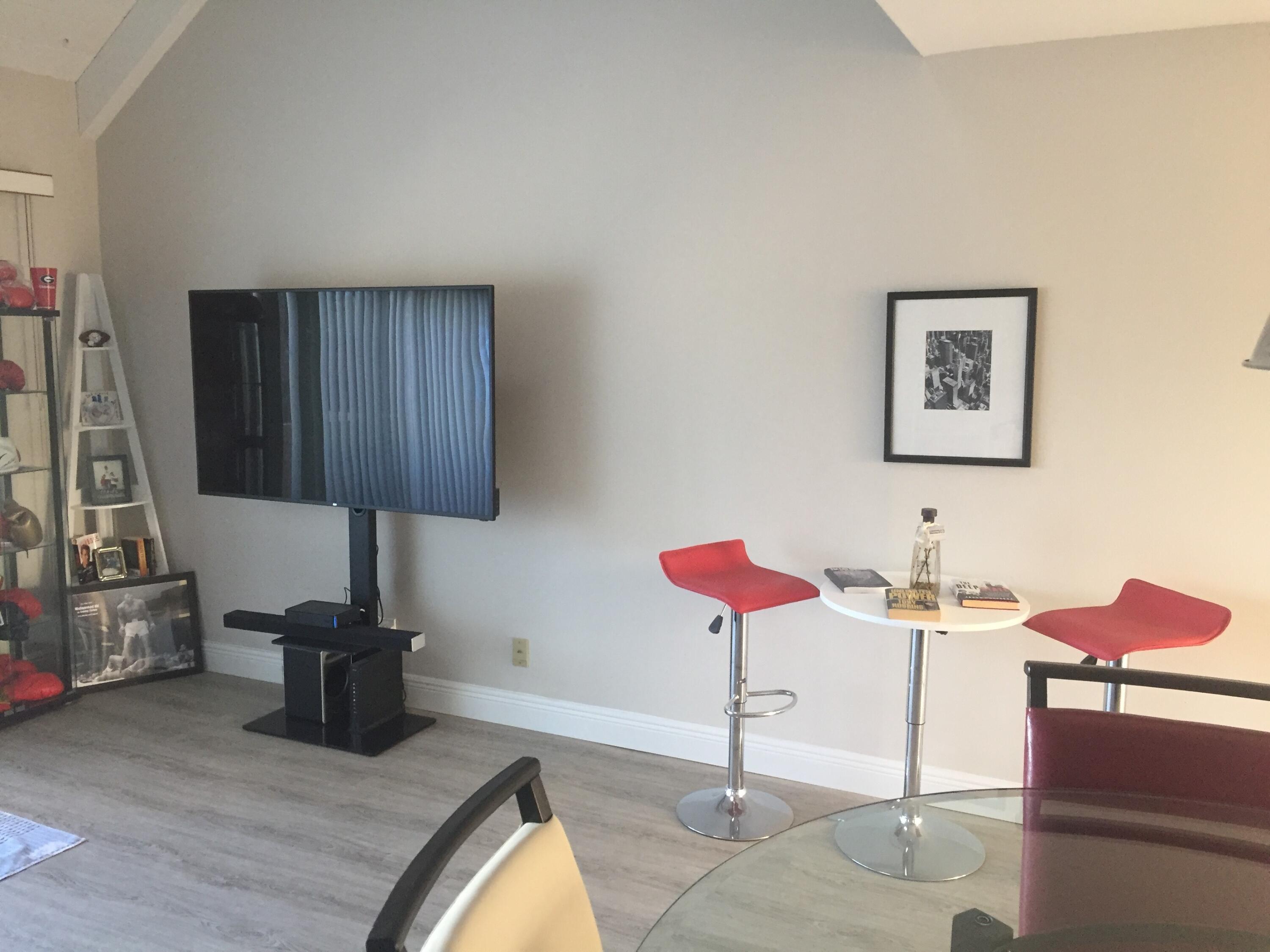 9 Deer Creek Road, Unit A206 Deerfield Beach, FL 33442 - Photo 4 of 6 a room with table and chair
