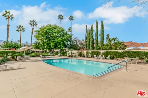 a view of a swimming pool with a patio
